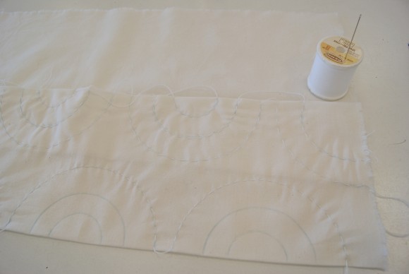 First sew the outer circles through both layers of fabric with running stitch