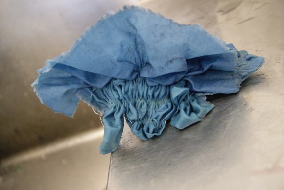 Gathered fabric taken out of the indigo dye