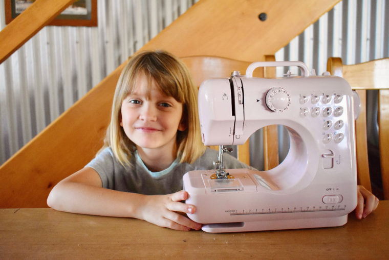 Teaching kids to sew.