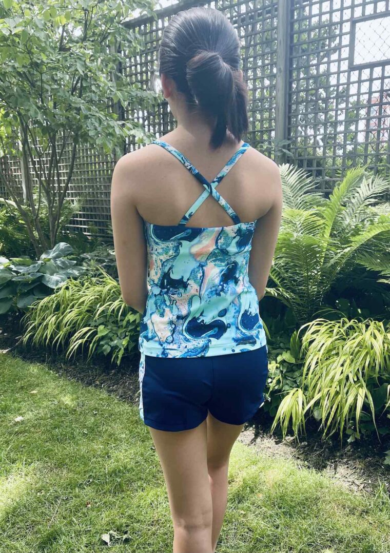 Back view of teen girl wearing swimwear top made from Liesl + Co Tribeca Cami Pattern