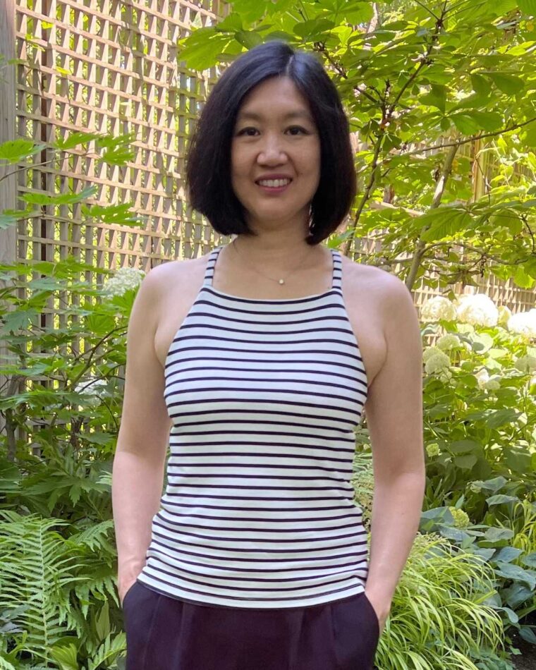 Woman wearing striped, bateau version of the Liesl + Co Tribeca Knit Cami