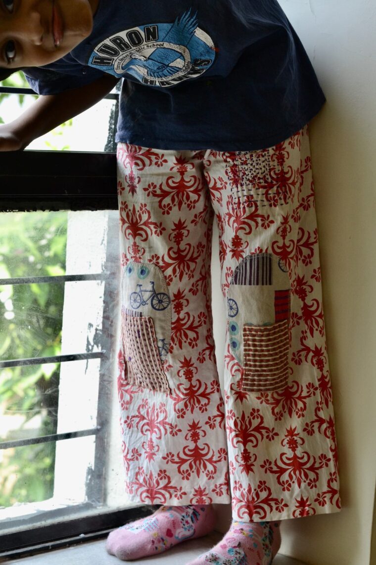 Oliver + S Sandbox Pants with visible mending on the knees