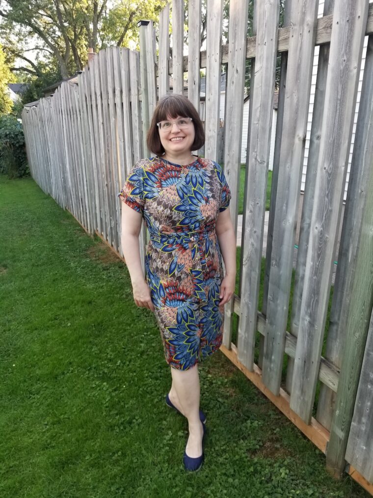 Woman standing in back yard wearing handmade dress