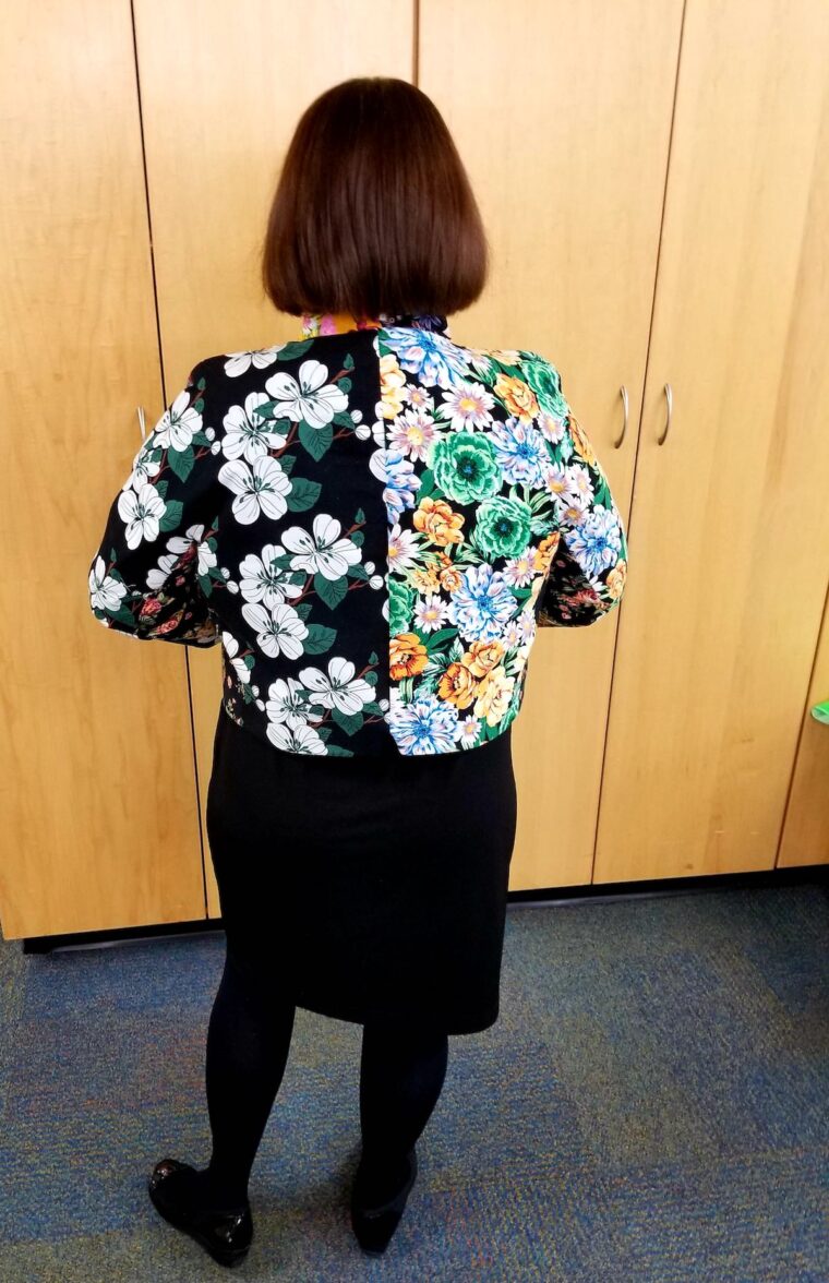 Back view of woman wearing a scrappy jacket