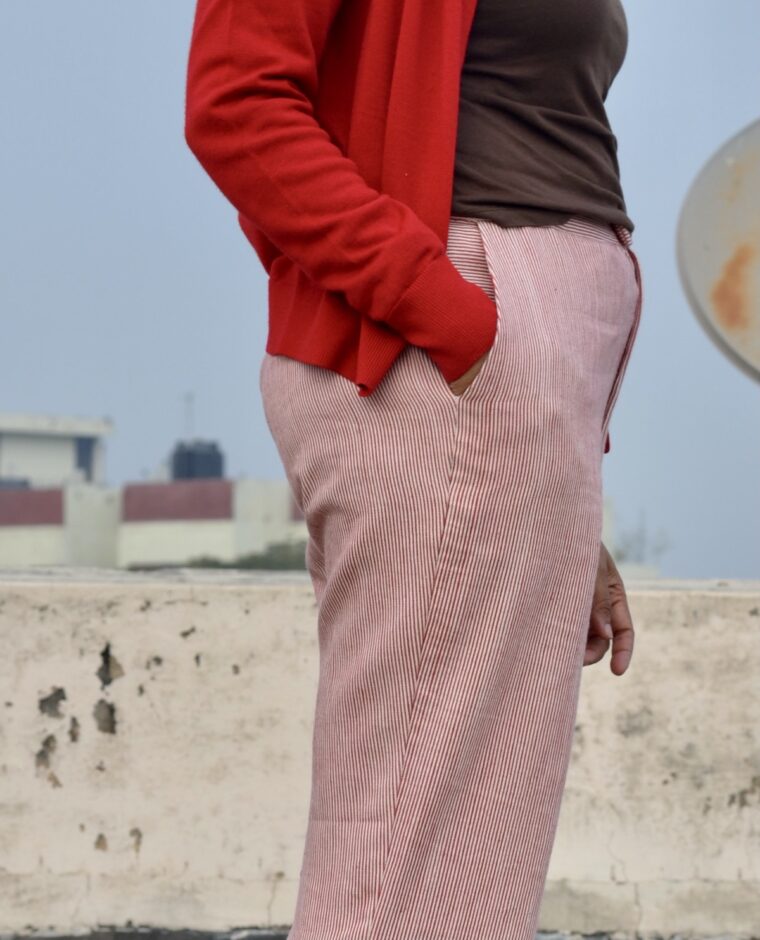 Close up of side trouser pocket. Woman as her hand in her pocket.