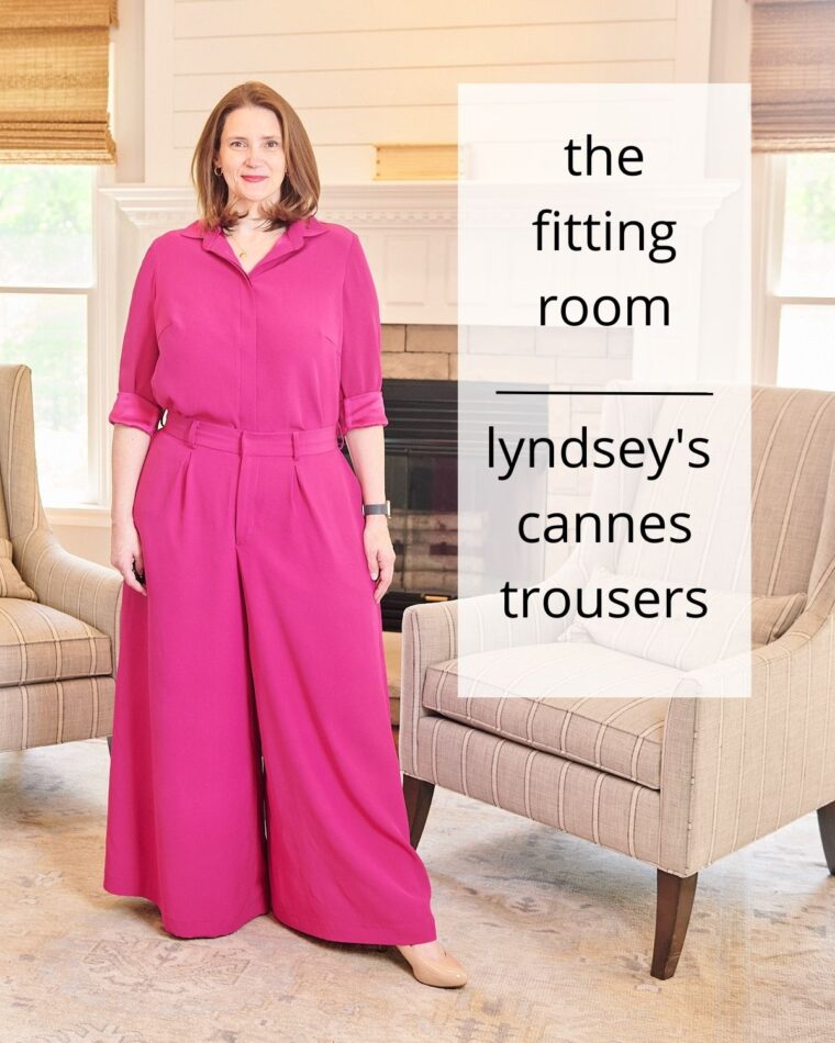 Woman wearing pink wide-legged trousers and matching pink blouse. The text on the image says "the fitting room: lyndsey's cannes trousers".