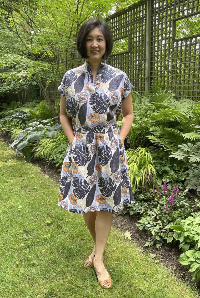 Woman standing in a backyard wearing a Santa Rosa top and matching Everyday skirt