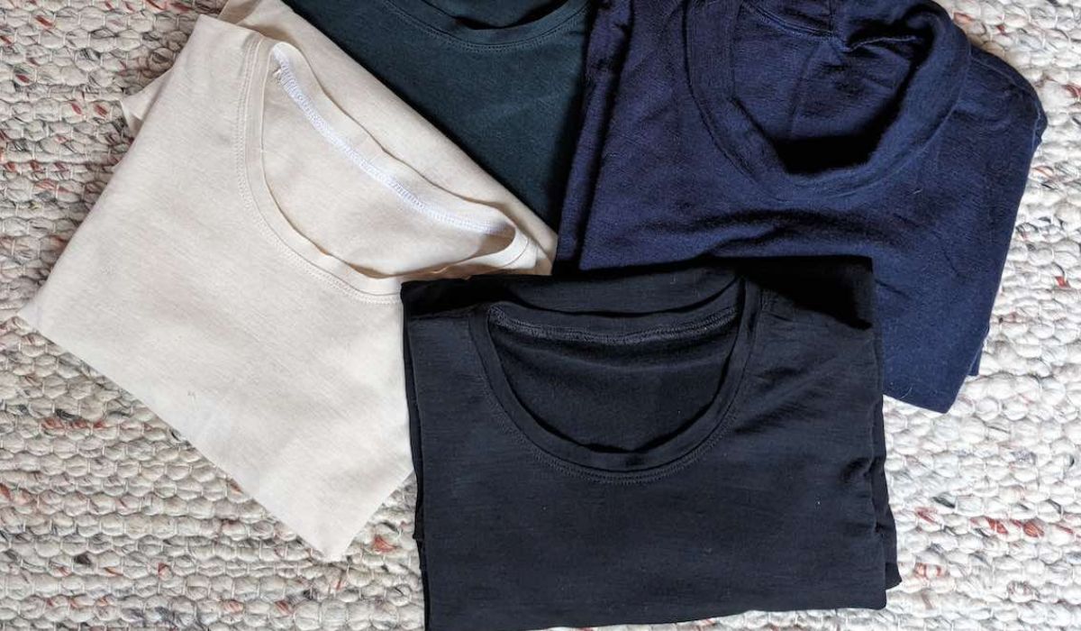 off-white, black and navy merino t-shirts folded on the floor