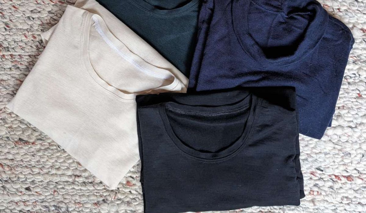 off-white, black and navy merino t shirts folded on the floor