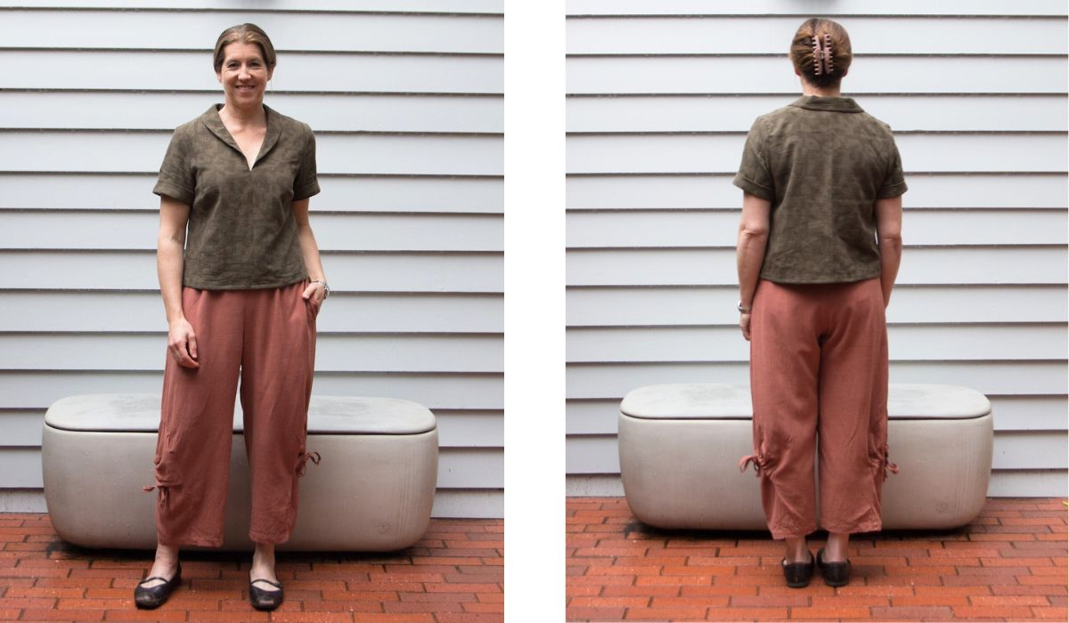 front and back views of a woman wearing a shawl collar linen short sleeve shirt with rust colored pants
