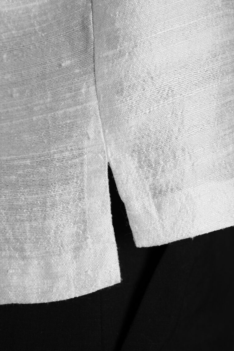 side vent detail of Liesl + Co Cyprus Woven Polo