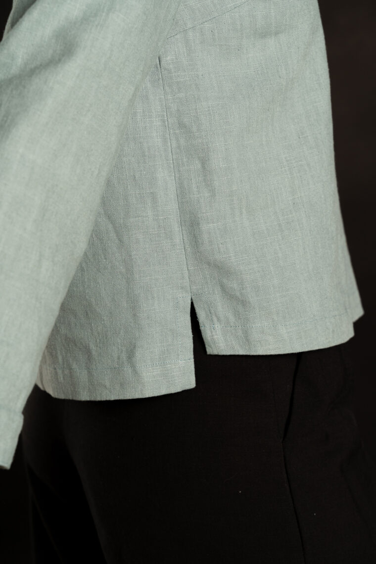 side vent detail of Liesl + Co Cyprus Woven Polo